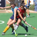 women playing field hockey